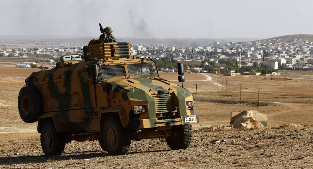 Turkish military on the Syrian border, across from the town of Kobani, October 2014. Photo credit: REUTERS.