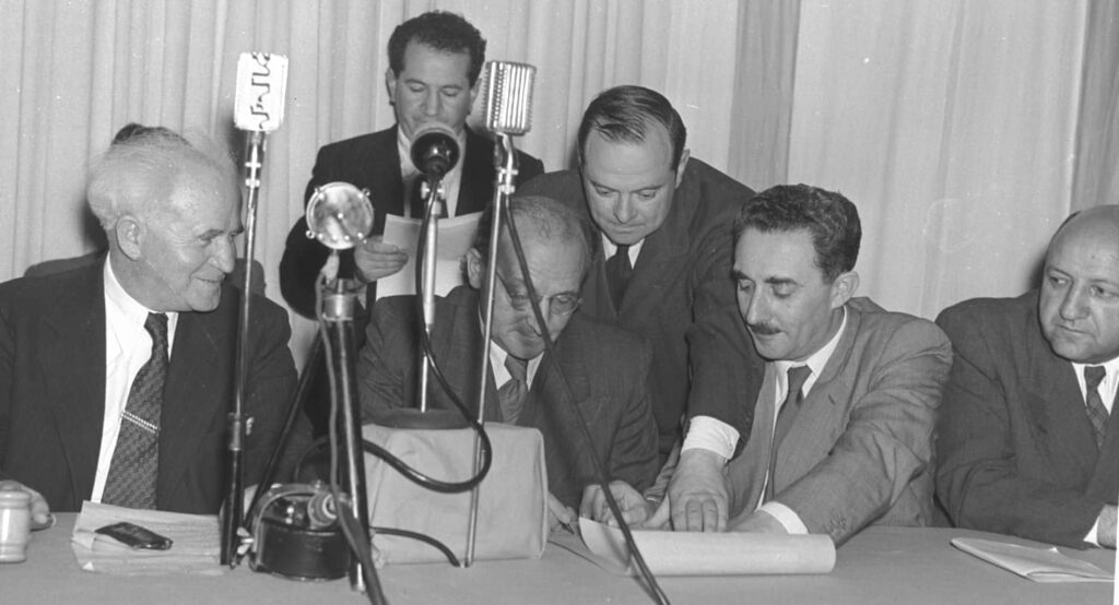 Signing the Declaration of Independence, May 14, 1948, with Moshe Shertok second from right; David Ben-Gurion on far left. Photo credit: Shershel Frank / Government Press Office.